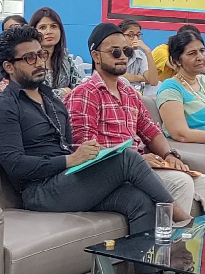 A candid shot of me during a judging session for a school dance competition. I take the responsibility of evaluating young talent very seriously.