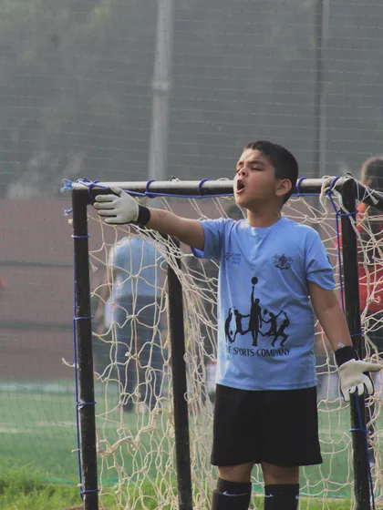 A goalkeeper commands his area, a crucial role in any successful team.