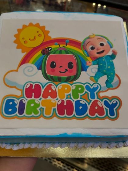 This Cocomelon photo cake is a great option for a simple and quick celebration. It features a bright and colorful edible image of the popular characters, guaranteed to make any toddler happy.