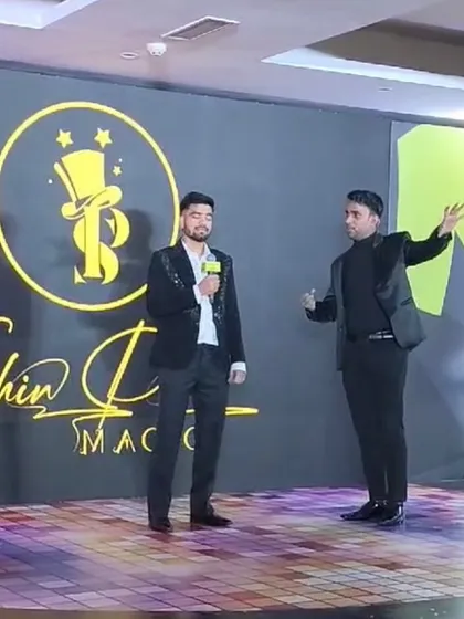 Performing a mentalism routine with a guest on stage at the inDrive event. The audience's focus is entirely on the mystery.