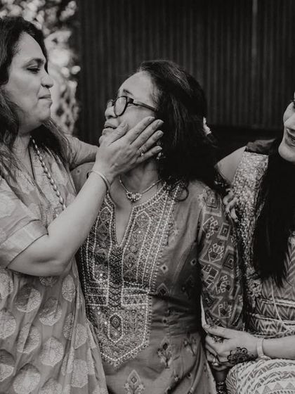 A beautiful, candid moment of affection between three generations of women. A tribute to the strength and love of mothers.