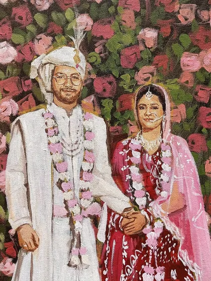 A close-up from a live wedding painting in Delhi. The focus here is on the couple's expressions and the beautiful floral garlands.
