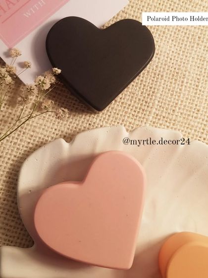 One of our bestsellers, the heart-shaped Polaroid photo holder. Shown here in solid black and soft pink, these are a simple and elegant way to display your favorite memories.