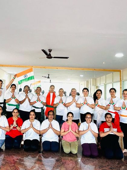 The entire class in a prayer pose, offering gratitude on Independence Day. A moment of peace and unity.