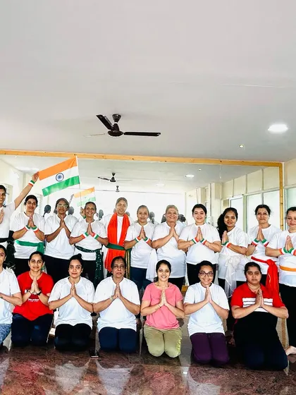The entire class in a prayer pose, offering gratitude on Independence Day. A moment of peace and unity.