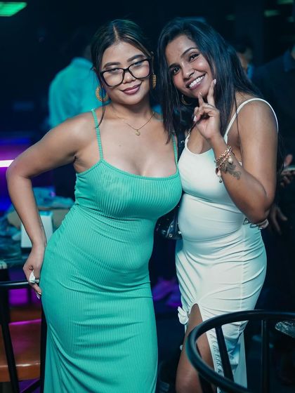 Two friends posing for a photo.