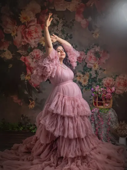 A duplicate of image 45, included for completeness. A joyful and expressive pose against a vibrant floral backdrop.