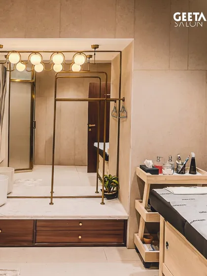 A private treatment room at our Shilp Shivalik salon in Ahmedabad. The elegant design, with its warm lighting and modern fixtures, provides a tranquil space for personalized skincare rituals.