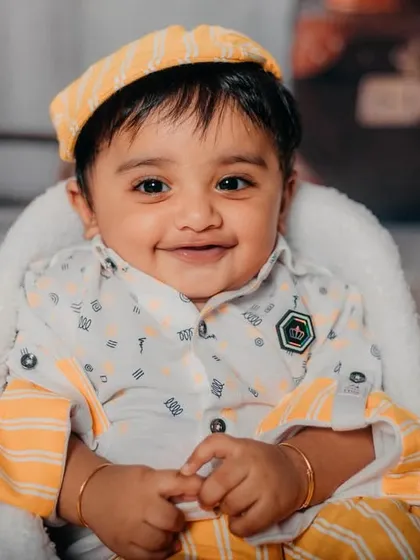 This 6-month-old cutie is all smiles for his travel-themed photoshoot.