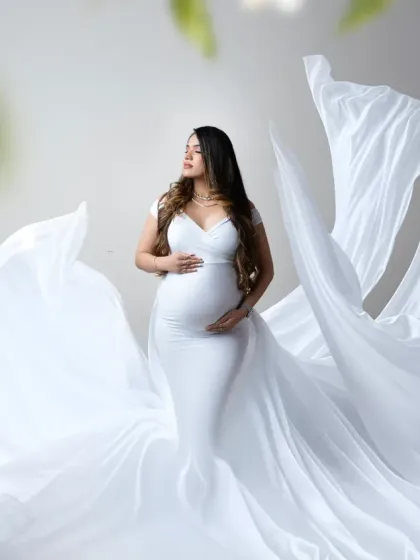 An ethereal portrait with flowing white fabric. We love using fabric to create a sense of movement and magic, as seen in this stunning, airy photograph.