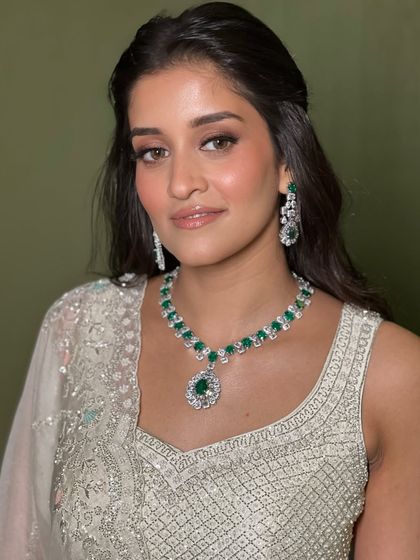 Soft glamour at its finest. For this bride in an elegant white lehenga, I created a minimal yet impactful look with a focus on glowing skin and softly smoked-out eyes, letting her natural beauty shine.