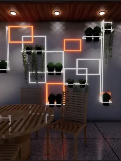 A unique terrace dining area designed during lockdown, featuring a custom geometric wall shelf with integrated lighting. This space is perfect for intimate dinners and enjoying the evening air.