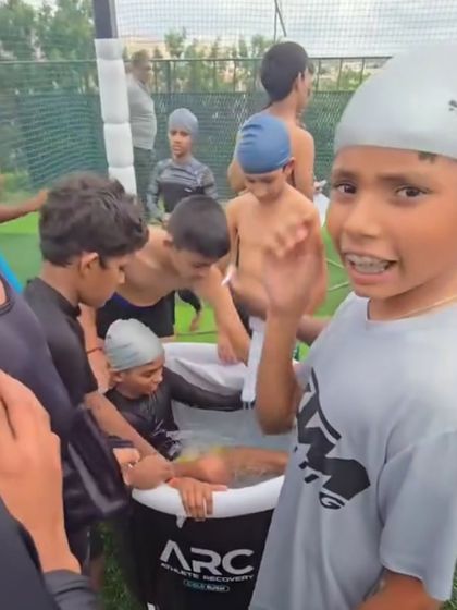 Post-match recovery is just as important as training. Here, the young athletes are taking an ice bath, a crucial practice for muscle recovery and injury prevention.