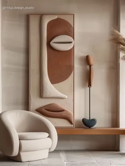 Details matter. I often source or commission unique art pieces to complete a space. This textured, sculptural wall art in earthy tones adds an organic, sophisticated element to the room, proving that the right decor can transform a wall into a conversation starter.