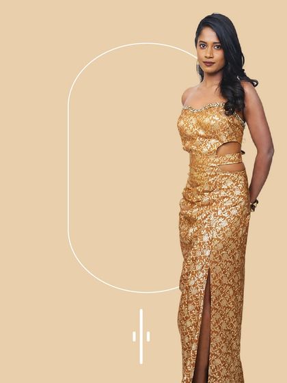 This gold sequin gown with side cutouts is pure glamour. It's a perfect rental for a cocktail party or a sangeet where you want to shine on the dance floor.