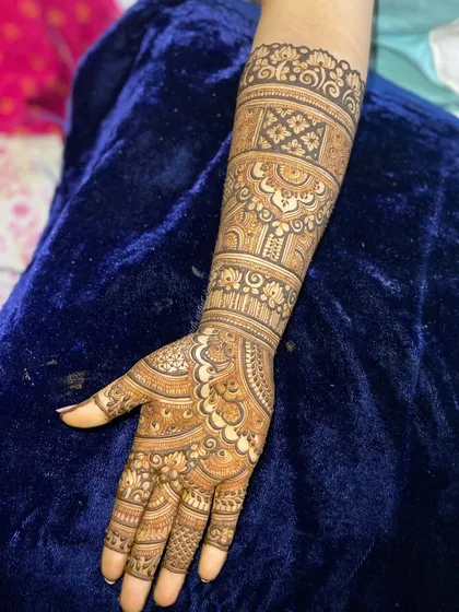 A single arm view of a detailed bridal or engagement design, showcasing the clean lines and intricate patterns.
