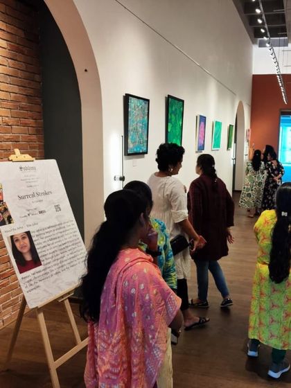 The beginning of 'Surreal Strokes' by Ekta Johar at our Hyderabad gallery, with visitors exploring the imaginative artworks.