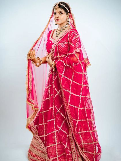 The flow and design of the dupatta are highlighted in this shot, showing the complete elegance of the outfit.