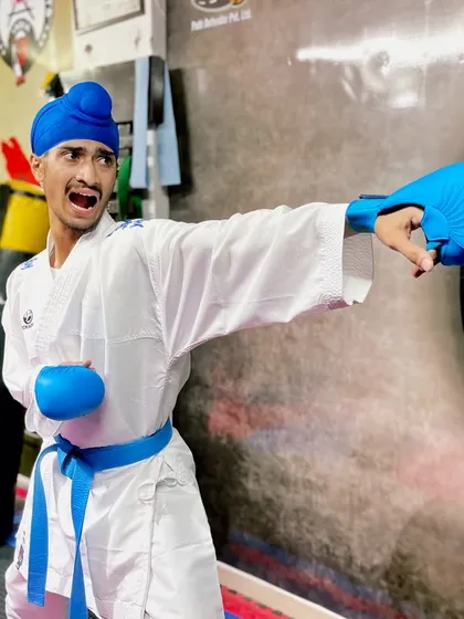 The Kiai, or martial arts shout, is used to focus energy and power into a single strike. Here, I'm practicing a Gyaku-zuki (reverse punch) on the heavy bag, a fundamental power shot in Kumite.