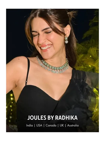 A candid moment of pure joy. Kriti Sanon's beautiful smile is the best accessory to our mint-green beaded choker set.