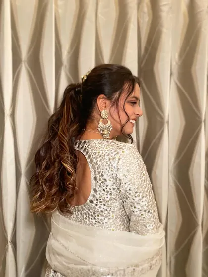 A side view of the textured ponytail with stone clips, showing how it adds a touch of glamour to the overall look.