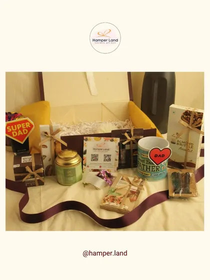 A Father's Day hamper perfect for the 'Super Dad'. This gift box includes a 'Dad' mug, premium chocolates, a jar of dry fruits, and other goodies, all tied together with a rich brown ribbon.