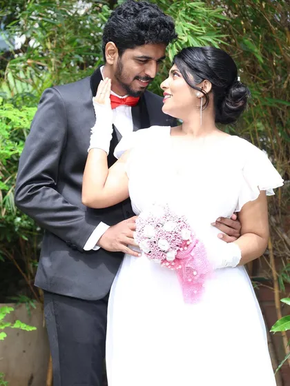 A candid, happy moment between the couple. The makeup is designed to look natural and radiant, perfect for capturing genuine emotions.