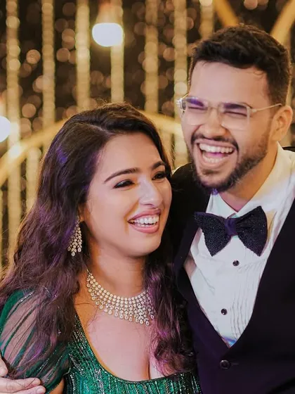 A candid moment of laughter between Pragya and Akhil at their reception. Our goal is to create a relaxed and joyful atmosphere where couples can truly enjoy their celebration.