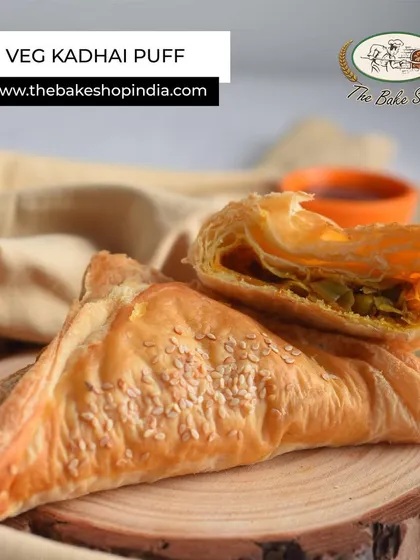 The Veg Kadhai Puff is a perfect evening snack. It has a flaky, buttery pastry filled with a spicy and flavorful vegetable mix.