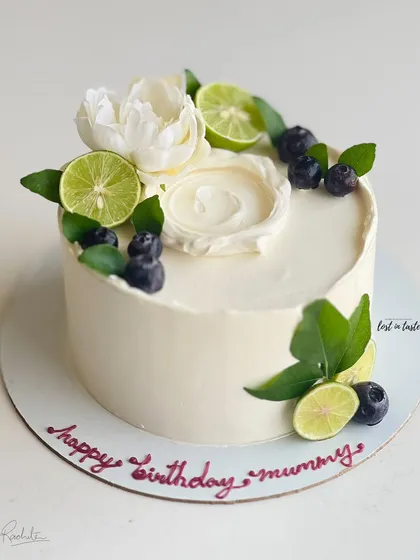 My most popular creation, the signature Italian Lemon & Blueberry cake. I offer many design variations, all featuring fresh blueberries, zesty lime, and smooth buttercream.
