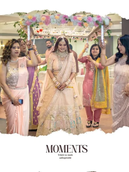 The bride's grand entrance under a 'phoolon ki chadar' held by her loved ones.