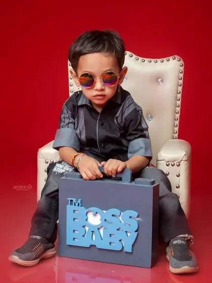 Who's the boss? This little guy is, in his 'Boss Baby' themed third birthday shoot. Complete with sunglasses and a briefcase, he's got all the attitude for a fun and memorable photo.