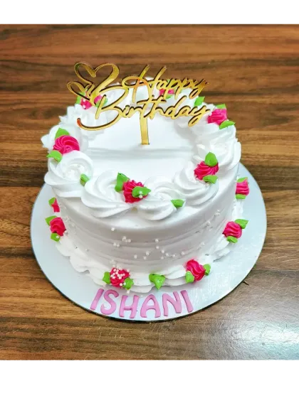 A simple and pretty floral cake for Ishani's birthday. This chocolate mousse cake is decorated with small pink rosettes.