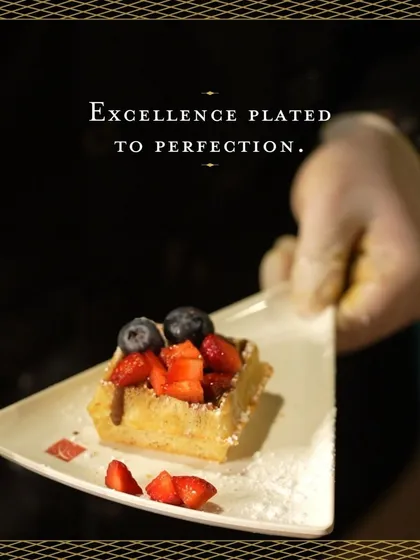 Excellence plated to perfection. A mini waffle topped with fresh strawberries and blueberries, showcasing a simple yet elegant dessert option from our live stations.