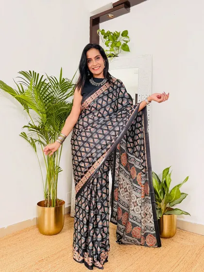 A black and beige geometric print saree in a soft, washable fabric. This is a very smart and modern choice for office wear, and it's under 1000 rupees.