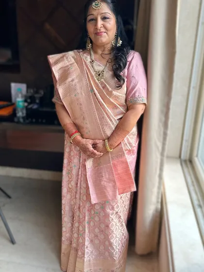 Sophistication, grace, and just a touch of sparkle. This elegant look was created for the mother of the bride, ensuring she felt special.