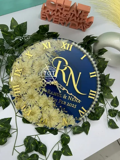 A slightly different angle of the personalized clock, showing how the light reflects off the glossy resin surface and the golden Roman numerals.