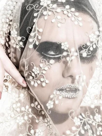 Another take from our artistic beauty shoot. This close-up focuses on the intricate details of the embroidered veil and the dramatic eye makeup, showcasing a more experimental side of my styling work.