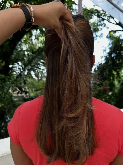 Be the life of every party with hair that shines. I gave her these bold, chunky highlights on a layered cut for a fun and glamorous look that’s sure to turn heads.