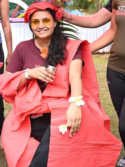 The creative result of a 'fashion show' team-building game, where teams have to dress up a model using limited supplies. This activity sparks creativity, resourcefulness, and a lot of laughter.