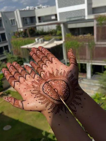 A bold and beautiful mandala design, perfect for making a statement. This style focuses the artwork on the center of the palm, accented with detailed finger caps and delicate sun-ray patterns.