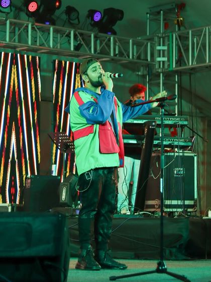 A full view of Shashwat Singh and his keyboardist on stage, highlighting the live band setup we provide.