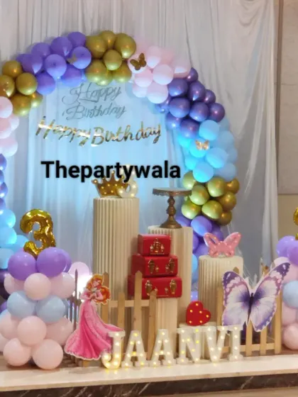 A double birthday celebration with a princess theme! This setup uses a mix of pastel balloons and includes props for both birthday girls.