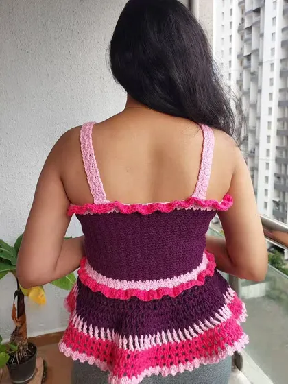 A view from the back of the Azores Top, highlighting the simple straps and ruffled neckline.