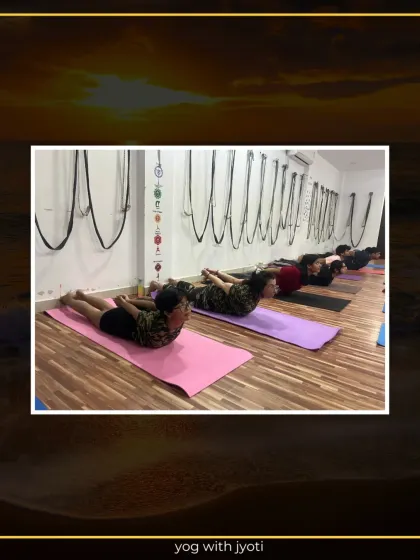 Another view of the class in Sarpasana, showing synchronized movement and focus.