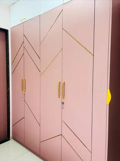 A close-up of the geometric pattern and the high-quality finish on the pink wardrobe doors.