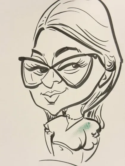 A close-up of a caricature of a woman with stylish glasses. The focus is on capturing her unique features in a fun way.
