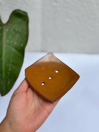 Our soap dish in the Languid Magic glaze. The warm, amber tones will brighten up any bathroom.