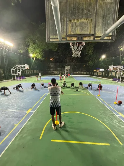 A full-court view of a conditioning session. Our players are working on core strength and endurance to ensure they can perform at their best for the entire game.