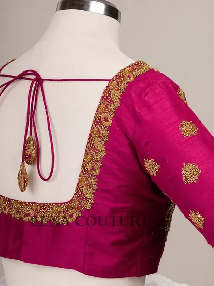The classic Katori blouse is all about the perfect fit and timeless charm. This version in magenta raw silk is adorned with simple but elegant gold butti embroidery, making it a versatile choice for any traditional event.